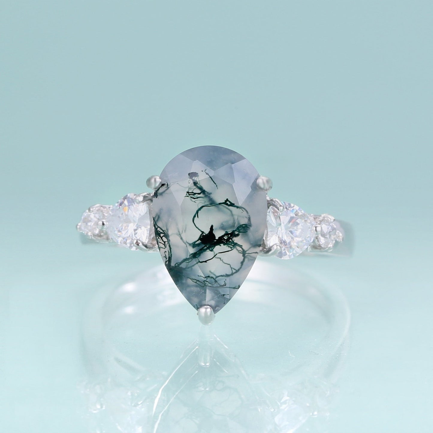 Moss agate pear-shaped ring in silver