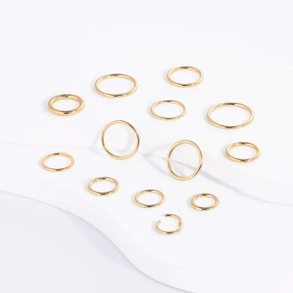Gold minimalist rings set on white background, Rosary Milano fashion jewelry