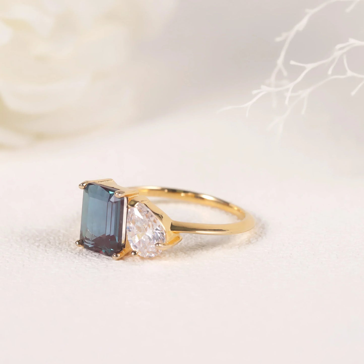 You and me ring with a color-changing alexandrite stone and a clear cz