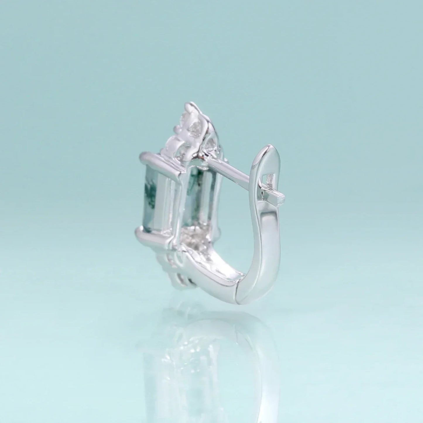 RosaryMilano silver fashion earring with gemstone detail on light blue background