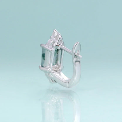 RosaryMilano silver fashion earring with gemstone detail on light blue background