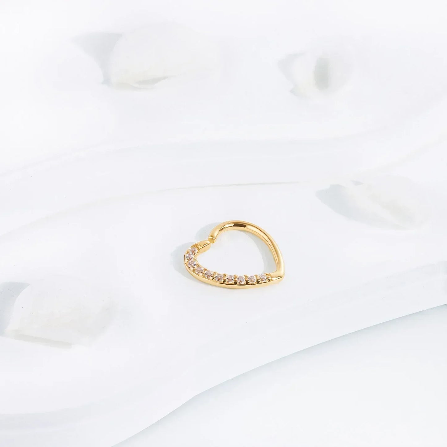 Gold heart-shaped fashion jewelry ring with crystals on white background, Rosary Milano