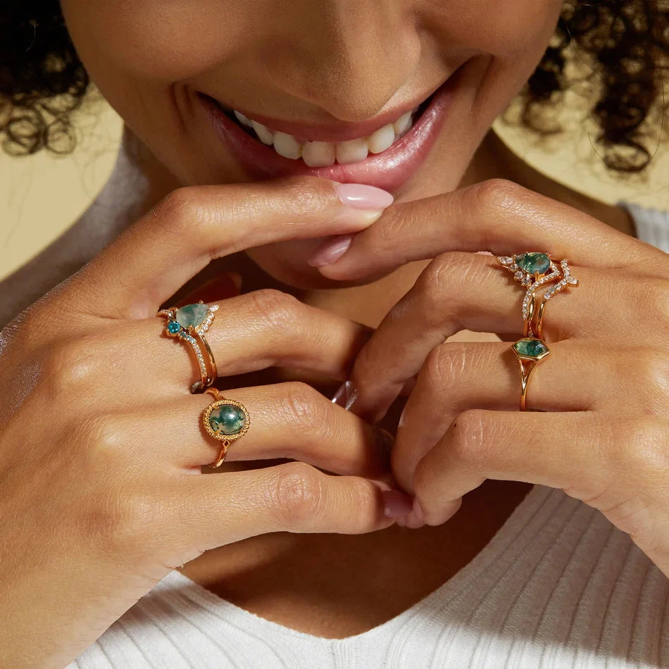 Moss agate wedding ring set with a pear-shaped moss agate sterling silver