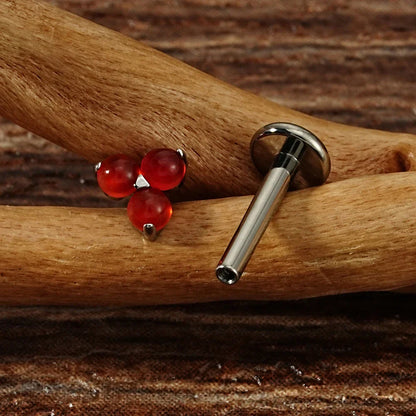 Cute Monroe piercing with natural gemstones red and green stones in silver and gold small Marilyn Monroe piercing titanium 16G