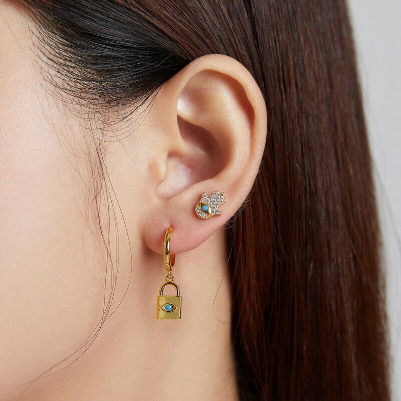 Evil eye and lock earring