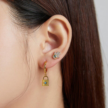 Evil eye and lock earring