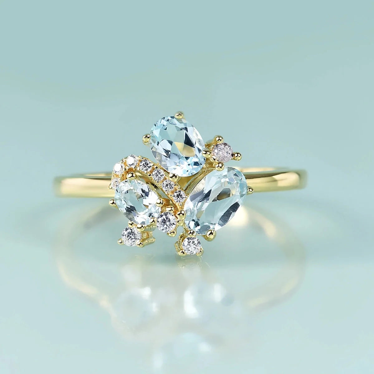 Three-stone blue topaz ring