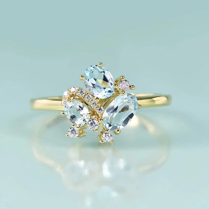 Three-stone blue topaz ring