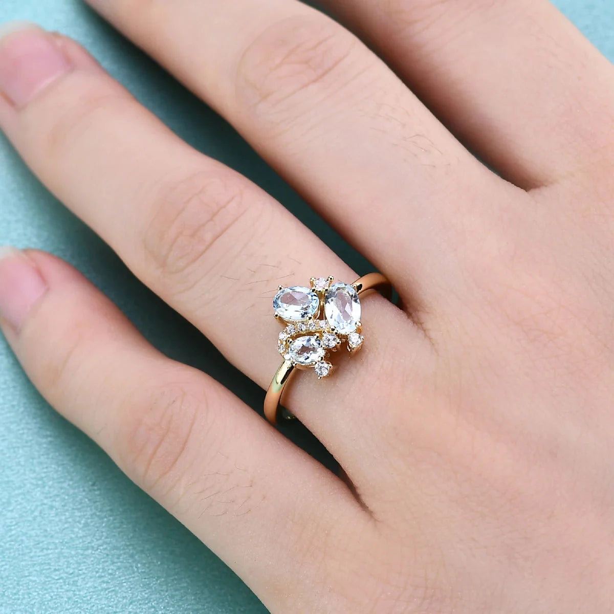 Three-stone blue topaz ring