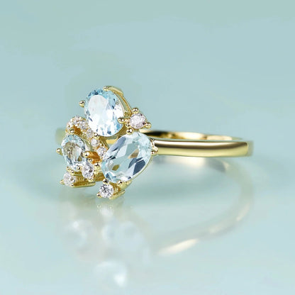 Three-stone blue topaz ring