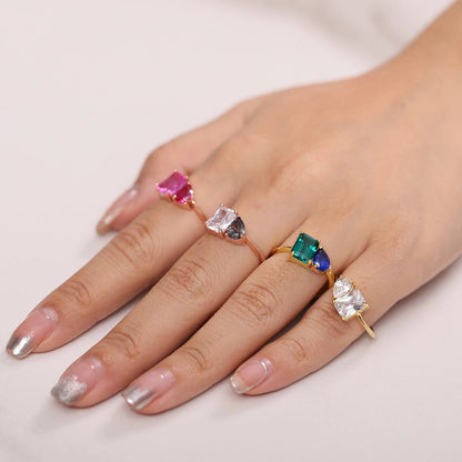 Toi et moi ring emerald and sapphire